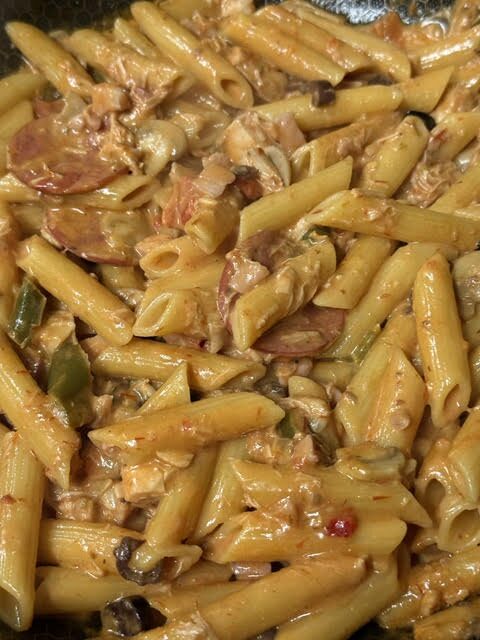 Godfather penne pasta in Napoletana and cream sauce with salami, bacon and chicken